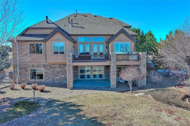 back of property featuring a patio and a yard