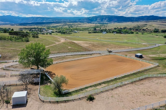 drone / aerial view with a mountain view and a rural view