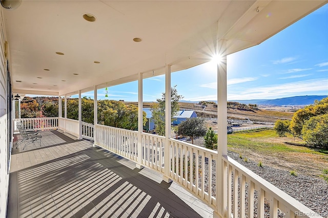 wooden deck featuring a mountain view