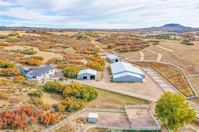 birds eye view of property with a mountain view