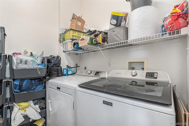 washroom with laundry area and independent washer and dryer