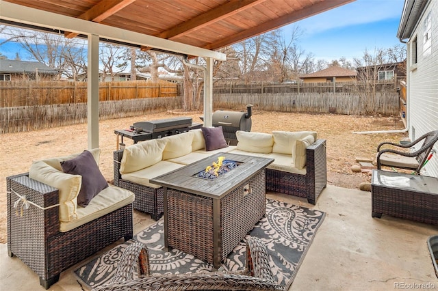 view of patio / terrace featuring an outdoor living space with a fire pit