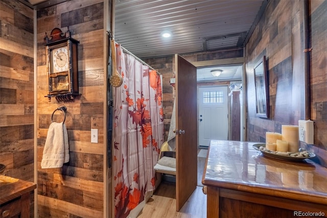 full bathroom featuring wood ceiling, wood walls, wood finished floors, and vanity