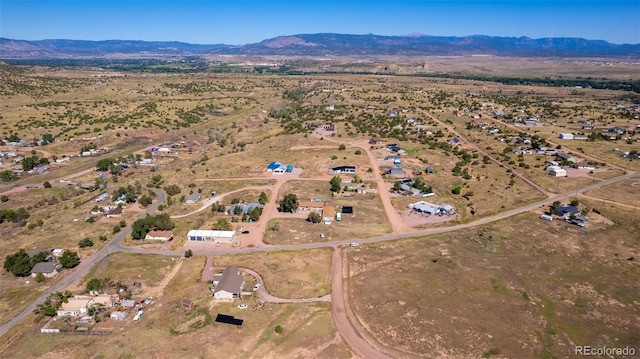 aerial view featuring a mountain view and a rural view