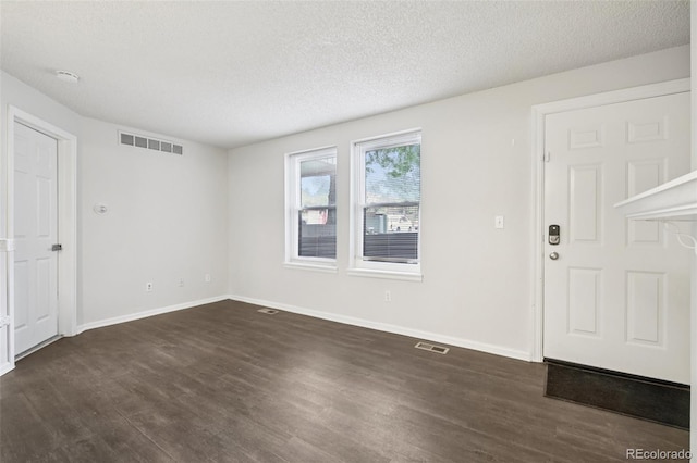 6705 S Field St Unit 803, Littleton, CO 80128 - entryway featuring dark wood finished floors and a textured ceiling