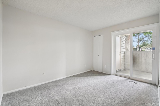 6705 S Field St Unit 803, Littleton, CO 80128 - empty room with carpet and a textured ceiling