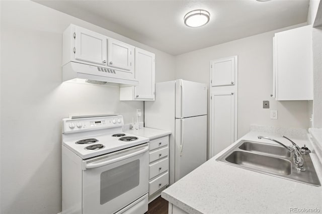 6705 S Field St Unit 803, Littleton, CO 80128 - kitchen featuring white appliances, under cabinet range hood, white cabinetry, and light countertops