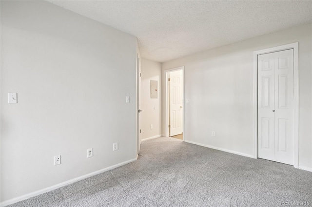 6705 S Field St Unit 803, Littleton, CO 80128 - spare room featuring carpet floors and a textured ceiling