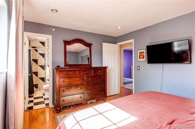 bedroom featuring recessed lighting and wood finished floors