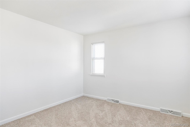 unfurnished room with carpet flooring