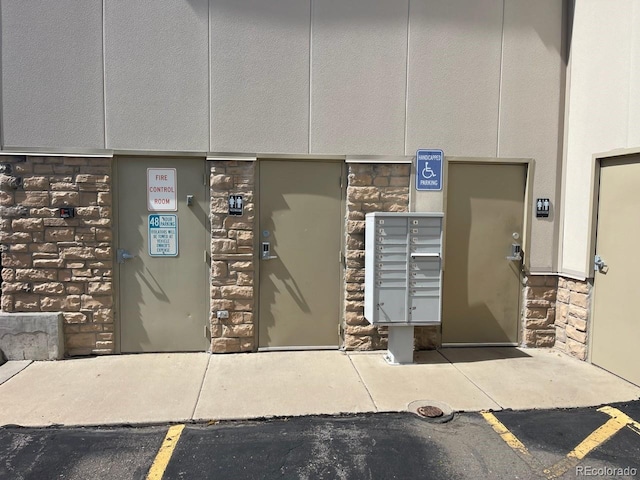 7152 S Blackhawk St Unit C12, Englewood, CO 80112 - property entrance with stone siding
