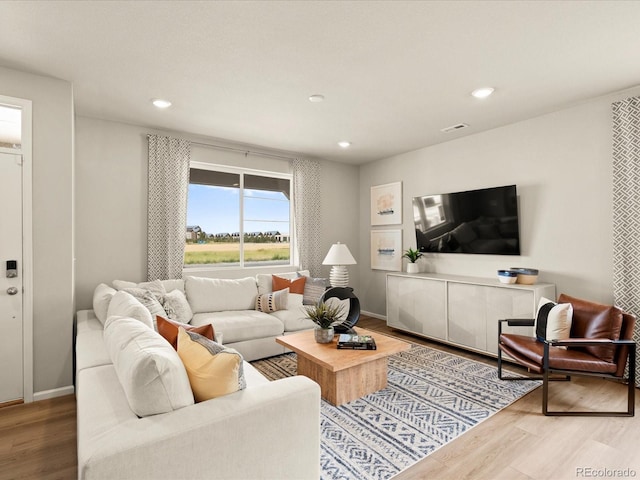 20802 E 66th Ave, Aurora, CO 80019 - living area featuring wood finished floors, recessed lighting, and baseboards