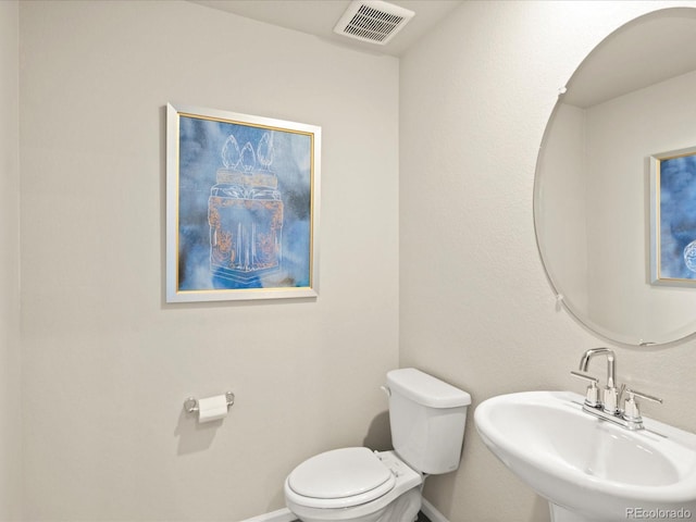 20802 E 66th Ave, Aurora, CO 80019 - half bath with a sink, baseboards, and toilet