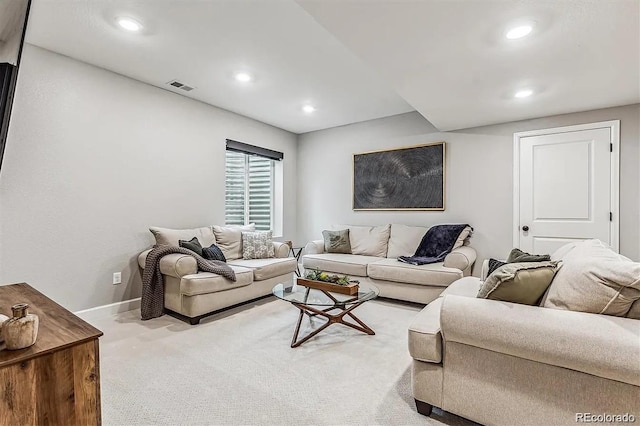 living area featuring carpet floors, baseboards, visible vents, and recessed lighting