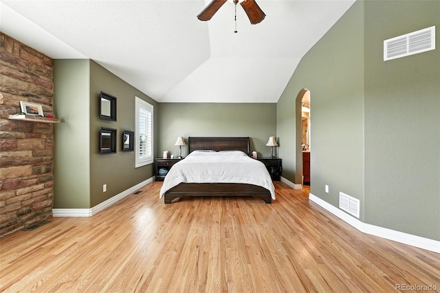 7809 S Coolidge Way, Aurora, CO 80016 - bedroom featuring wood finished floors, arched walkways, a ceiling fan, and vaulted ceiling