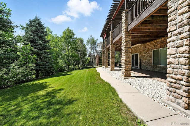 7809 S Coolidge Way, Aurora, CO 80016 - view of green lawn with a patio