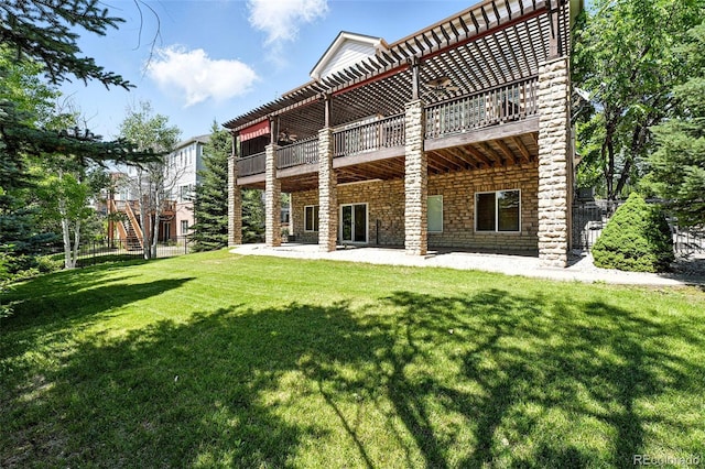 7809 S Coolidge Way, Aurora, CO 80016 - rear view of house with a patio and stone siding