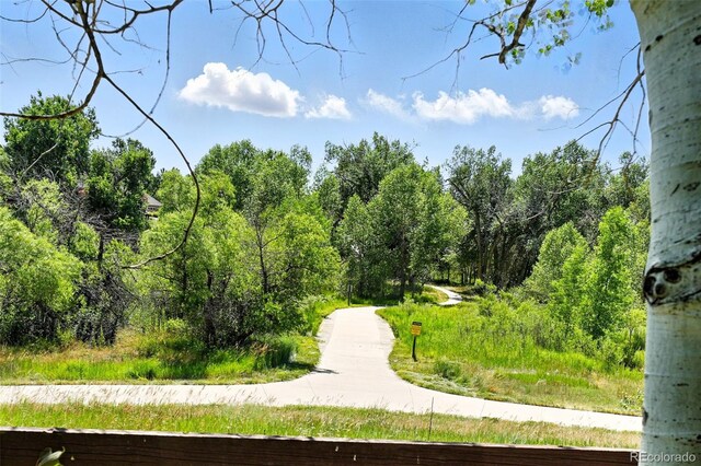 7809 S Coolidge Way, Aurora, CO 80016 - view of community featuring a wooded view