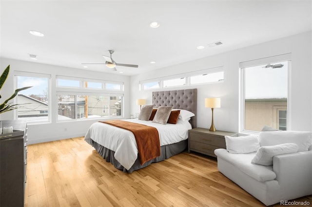 bedroom featuring light wood finished floors, visible vents, a ceiling fan, and recessed lighting