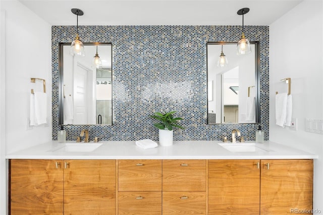 full bath with double vanity and a sink