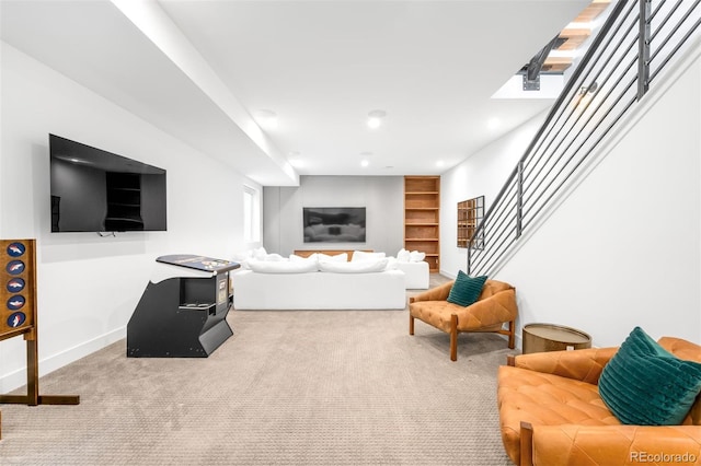 carpeted living area with recessed lighting, stairway, and baseboards