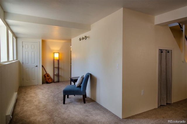 sitting room featuring carpet and baseboard heating