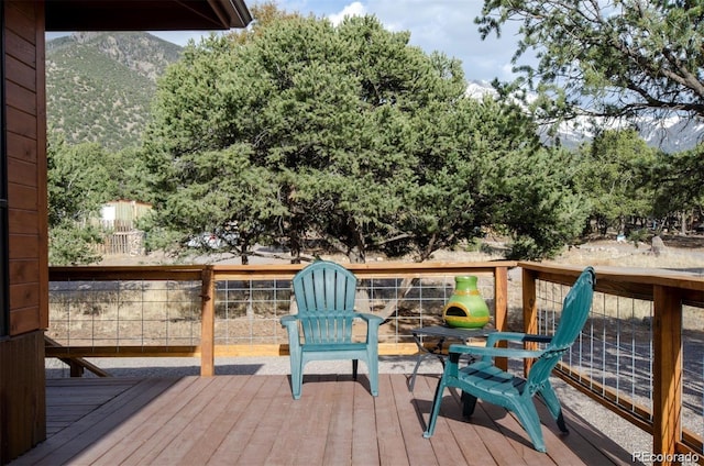 wooden deck featuring a mountain view