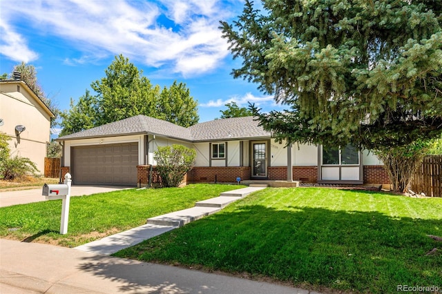 ranch-style home with brick siding, concrete driveway, an attached garage, fence, and a front yard