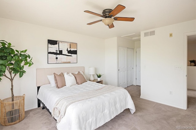805 Summer Hawk Dr Unit 100, Longmont, CO 80504 - bedroom featuring light colored carpet, baseboards, a closet, and ceiling fan