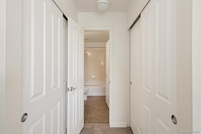 805 Summer Hawk Dr Unit 100, Longmont, CO 80504 - corridor featuring light tile patterned floors