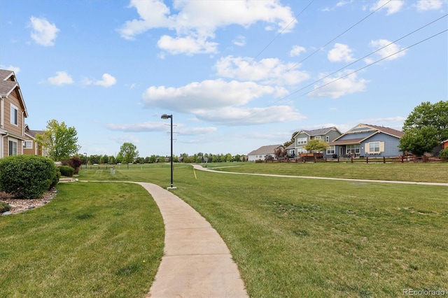 805 Summer Hawk Dr Unit 100, Longmont, CO 80504 - surrounding community with a yard and a residential view