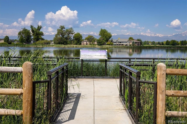 805 Summer Hawk Dr Unit 100, Longmont, CO 80504 - dock featuring a water view