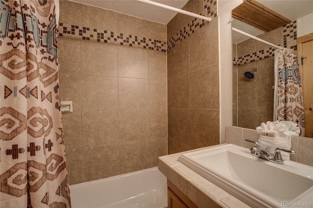 bathroom featuring shower / bath combo with shower curtain and sink