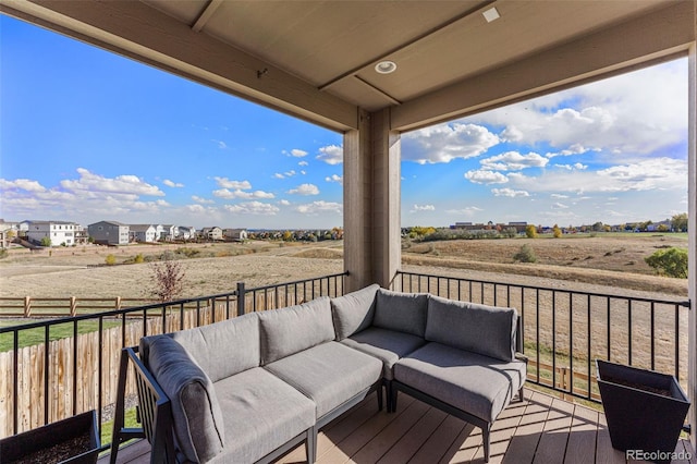 deck with a rural view and an outdoor living space