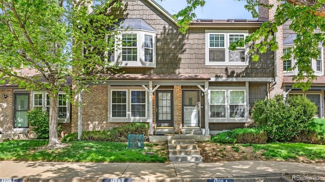 1209 S Flower Cir Unit C, Lakewood, CO 80232 - townhome / multi-family property with brick siding
