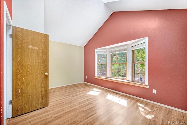 1209 S Flower Cir Unit C, Lakewood, CO 80232 - bonus room with lofted ceiling, wood finished floors, and baseboards