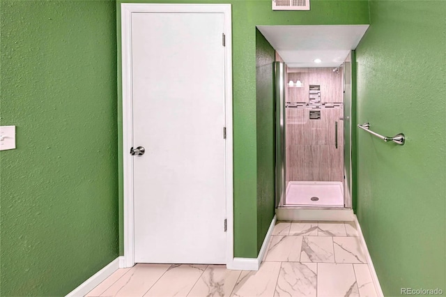 1209 S Flower Cir Unit C, Lakewood, CO 80232 - corridor featuring baseboards and light marble finish flooring