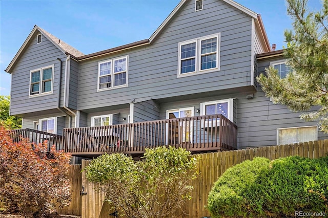 1209 S Flower Cir Unit C, Lakewood, CO 80232 - back of property featuring a wooden deck