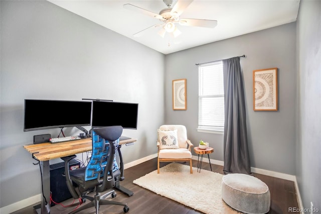 office space featuring baseboards, a ceiling fan, and wood finished floors