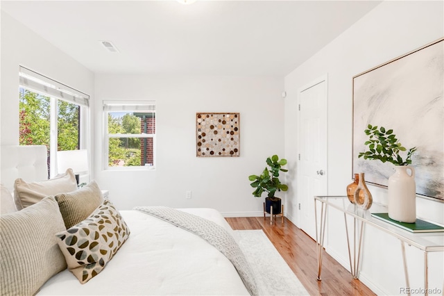 5044 W Moncrieff Pl, Denver, CO 80212 - bedroom featuring light wood-style floors and baseboards