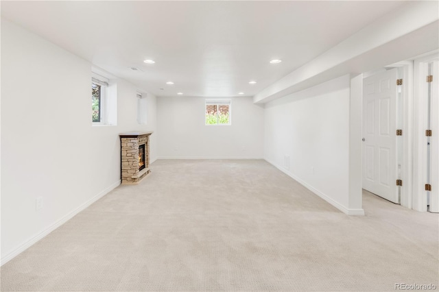 5044 W Moncrieff Pl, Denver, CO 80212 - basement with light carpet, a stone fireplace, and recessed lighting