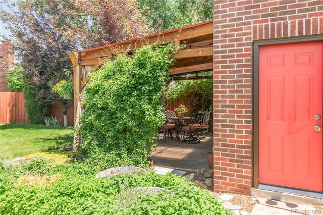 5044 W Moncrieff Pl, Denver, CO 80212 - property entrance featuring brick siding and outdoor dining area