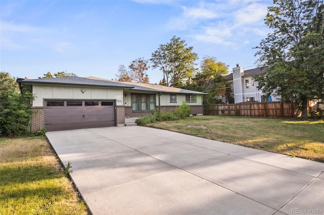 5054 W 61st Dr, Arvada, CO 80003 - view of front of property with an attached garage, brick siding, driveway, and stucco siding