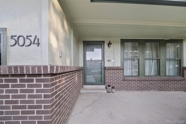 5054 W 61st Dr, Arvada, CO 80003 - entrance to property with brick siding