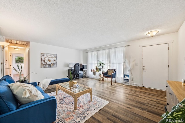 5054 W 61st Dr, Arvada, CO 80003 - living room with a textured ceiling and dark wood-style flooring