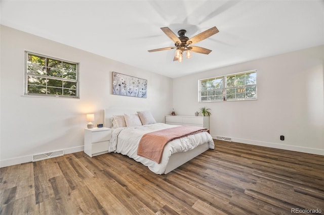 5054 W 61st Dr, Arvada, CO 80003 - bedroom featuring wood finished floors and a ceiling fan