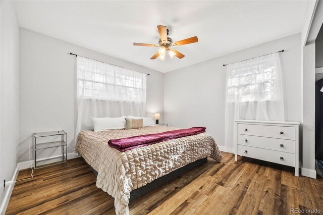 5054 W 61st Dr, Arvada, CO 80003 - bedroom with wood finished floors and ceiling fan