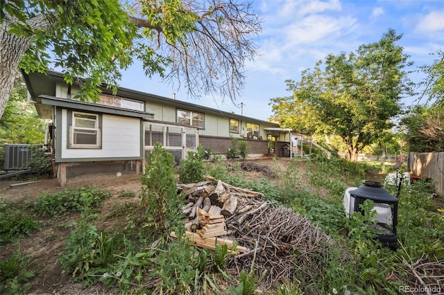5054 W 61st Dr, Arvada, CO 80003 - back of house featuring brick siding
