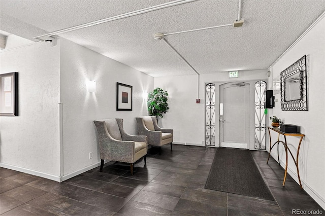 1365 Columbine St Unit 403, Denver, CO 80206 - foyer featuring a textured ceiling and baseboards