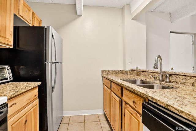 1365 Columbine St Unit 403, Denver, CO 80206 - kitchen featuring dishwashing machine, light tile patterned floors, light stone counters, and freestanding refrigerator